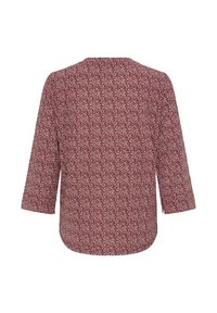 Bordeauxrotes Oberteil mit floralem Muster, dreiviertel Ärmeln, rundem Ausschnitt und einem abgerundeten Saum. Hergestellt aus einem leichten Stoff.