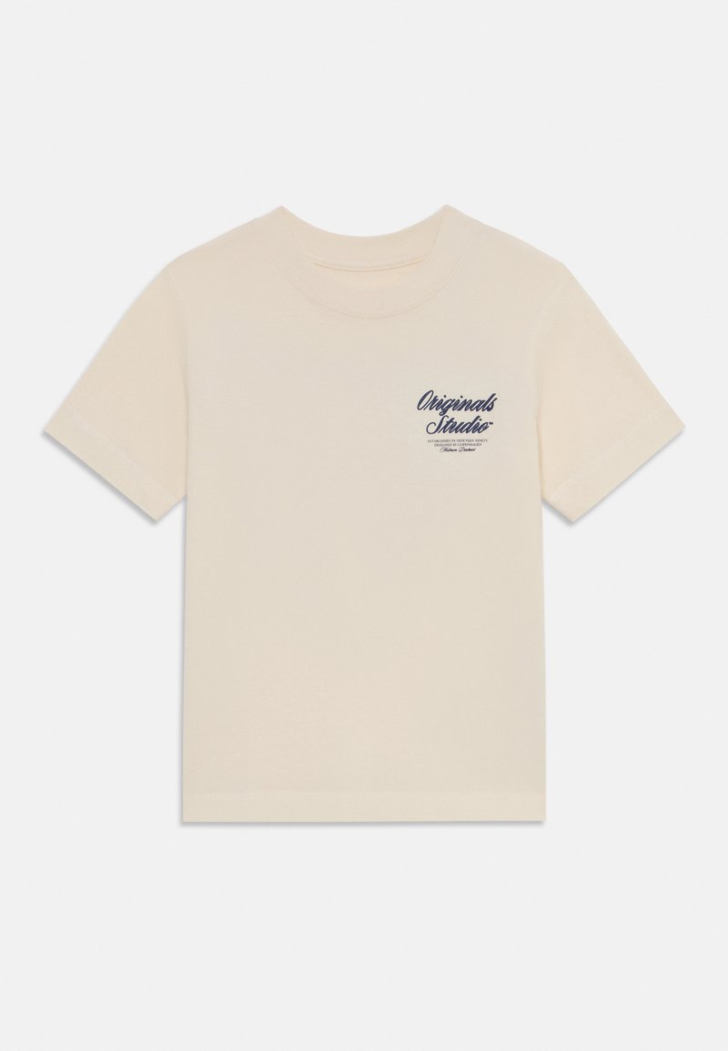 Cream-colored short-sleeve t-shirt made from soft cotton. Features a small navy printed logo on the left chest.
