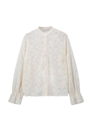 Witte kanten blouse met een hoge halslijn, lange mouwen, knoopsluiting en geraffineerde manchetten. Voorzien van bloemmotieven over het geheel.