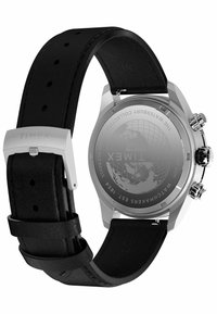 Timex watch with a stainless steel case and black leather strap. Features a solid back with a globe pattern and silver-tone hardware.