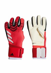 Guanti da portiere da soccer rossi con impugnatura testurizzata, accenti bianchi e un cinturino sul polso sicuro. Design flessibile con un mix di materiali e colori.