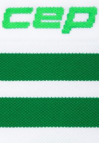 Tessuto a righe verdi e bianche con maglia strutturata. La parte superiore presenta il testo "cep" in grassetto verde.