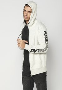 Koroshi Sudadera con cremallera - crudo
