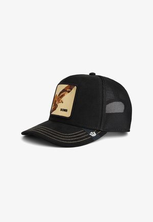 Black baseball cap with a rounded bill, featuring a yellow patch depicting a bird and the text "BOMB." Mesh back and contrasting stitching details.