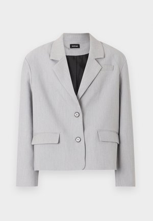 Vaaleanharmaa naisten bleiseri lovikauluksilla, kahdella etutaskulla, kahdella napilla ja mustalla vuorauksella.