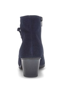 Navy blue suede ankle boot with a rounded toe, side zipper, and a chunky heel. Features a smooth texture and simple design.
