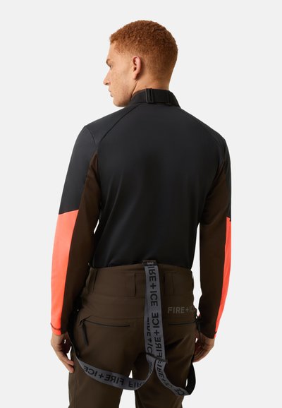 Long-sleeve shirt in black with brown and neon orange sleeves, featuring a smooth texture and a clip closure at the collar.