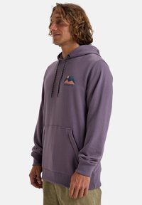 Purple hooded sweatshirt with a front pocket, black drawstrings, and a graphic design featuring mountains and a sun on the chest.