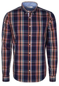 Chemise en flanelle à carreaux bleu marine avec des rayures blanches, orange et bleu clair. Elle possède un col boutonné et des manches longues avec des poignets à boutons.