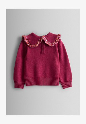 Bordo pleteni pulover s velikim naboranim cvjetnim ovratnikom, trodijelnim kopčanjem i rebrastim manžetama i rubom. Mekana tekstura i ležeran dizajn.