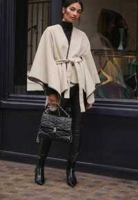 Next WHIPSTITCH - Köpeny - oatmeal black