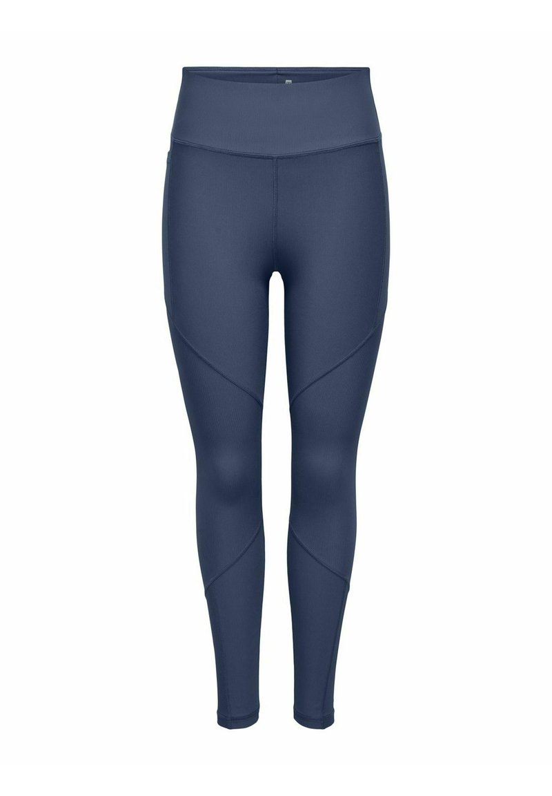 Rugalmas, nedvszívó anyagból készült leggings sötétké színben, magas derékkal és ferde varrással a karcsúsított megjelenés érdekében.