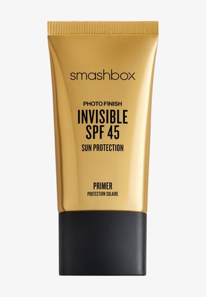 Base de maquillage protectrice Smashbox Photo Finish Invisible SPF 45 dans un tube doré avec un bouchon noir sur fond blanc.