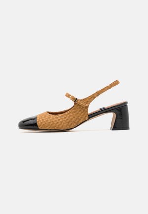 Slingback shoe with a woven tan upper, black patent leather cap toe, and a chunky heel. Adjustable strap for secure fit.