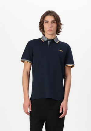Marineblå polo-shirt i bomuld med grå og gule detaljer, med krave, knaplukning og korte ærmer med ribkant.