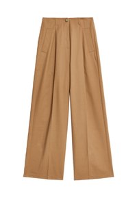 Breda byxor i en ljus tan-färg, tillverkade av ett mjukt tyg, med två framfickor och en central knappstängning.