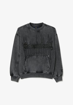 Grijze sweatshirt met een ronde hals, voorzien van een voorkantzak en een textuur zwart grafisch detail in het midden. Zachte stof, relaxed fit.