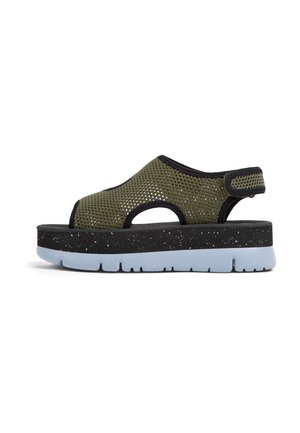 Mesh sandal with olive green upper, black accents, and speckled dark platform. Features a slip-on design with open toe and heel for ventilation.