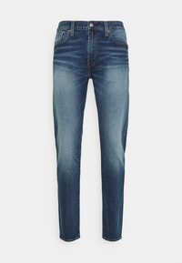 Tmavě modré džíny s hladkou denní texturou, s úzkým střihem nohavic, světlým vyblednutím vpředu a standardním designem s pěti kapsami.