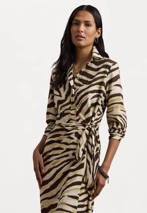 Brown and cream zebra-print dress with button-down front, long sleeves, and a tied waist detail. Features a smooth fabric texture.