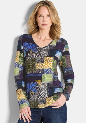 Langarm V-hals top met een patchwork ontwerp in levendige kleuren, dierenprints en verschillende texturen, gemaakt van rekbaar katoenmateriaal.