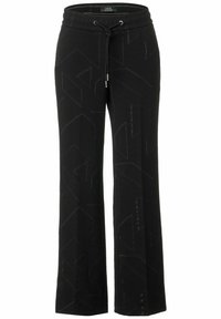 Pantalones de chándal negros de pernera ancha con cintura ajustable, que presentan un sutil patrón geométrico y una textura suave. Elaborados con una cómoda mezcla de tejidos.