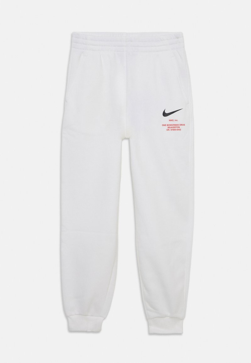 White sweatpants with an elastic waistband, side pockets, black Nike logo, and red text detail on the left leg. Cuffed ankles.
