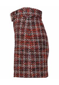 Minifalda de tweed con un patrón texturizado en negro, rojo y blanco, con un silueta ajustada y una cinturilla estructurada.