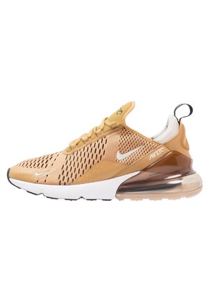 Nike Air Max sneaker in lichtbruin gaas met zwarte accenten, voorzien van een zichtbare luchtkussenzool, vetersluiting en textuur overlays.
