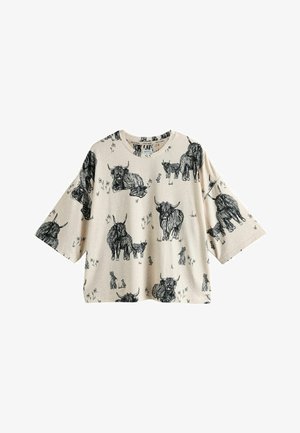 Šviesiai rudos spalvos trumparankovė marškinėliai su juodais įvairių gyvūnų, įskaitant karves ir triušius, eskizais, laisvo silueto ir apvalia iškirpte.