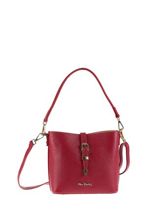 Red leather handbag with a textured finish, adjustable strap, buckle detail on the front, and gold-tone hardware accents.