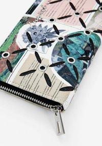 Zippered wallet made of synthetic material, featuring colorful floral and text patterns, black cutouts, and silver eyelets for detail.