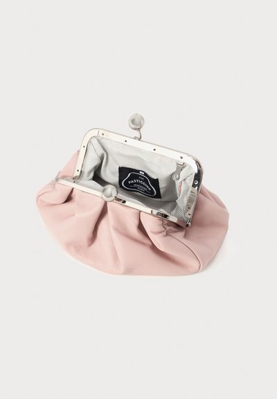 Light pink leather coin purse with a silver metal clasp and gathered design; interior features striped fabric and a black label.