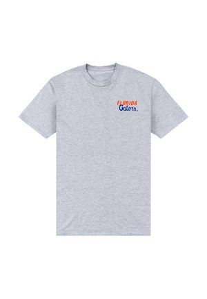 T-shirt gris clair à manches courtes avec le texte "Florida Gators" en orange et bleu sur la partie supérieure gauche de la poitrine.