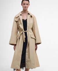 Beige trench coat with a belted waist, large collar, and muted sheen. Features wide sleeves and side pockets, layered over a black lace dress.