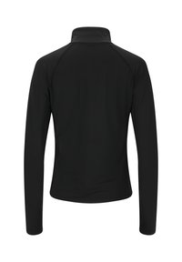 Mustat pitkähihainen neule, jossa on korkea kaulus ja joka on valmistettu sileästä materiaalista. Varustettu raglan-hihalla ja istuvalla muotoilulla. Ei erityisiä korostuksia.