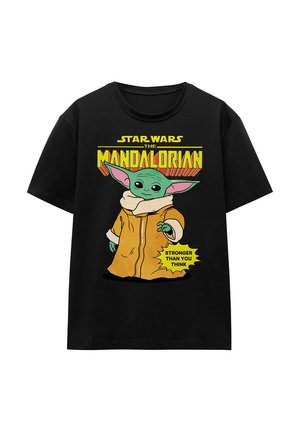 Black cotton t-shirt featuring a graphic of a green character in a tan robe, with text "Star Wars The Mandalorian" and "Stronger Than You Think."