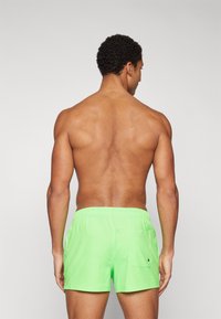 Puma SWIM MEN - Plaukimo šortai - green
