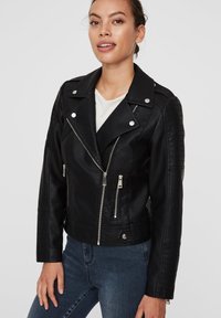 Black faux leather biker jacket with a zippered front, snap collar, and quilted accents on the shoulders. Features silver-tone hardware.