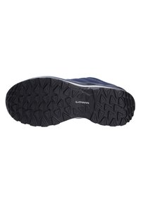 Low-cut hiking shoe with a black rubber outsole featuring multi-directional lugs, textured fabric upper in dark blue, and supportive construction.