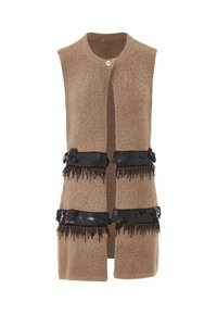 Beige ärmellose Weste mit einer flauschigen Textur, ausgestattet mit zwei schwarzen, mit Pailletten versehenen Bändern. Abgeschlossen mit einem einfachen, runden Knopfverschluss.