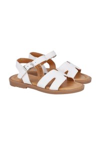 Sandalias de cuero blancas con correa ajustable y diseño troquelado, suela de goma marrón, tacón plano y textura suave. Adecuadas para el clima cálido.