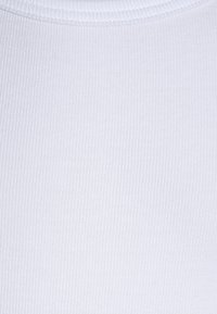White ribbed fabric texture with a smooth finish. Features a round neckline and consistent pattern throughout the garment.