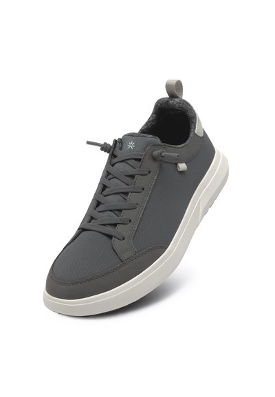 Gray sneaker with a textured fabric upper, lace-up closure, padded collar, and white rubber sole. Features a small logo detail and pull tab.