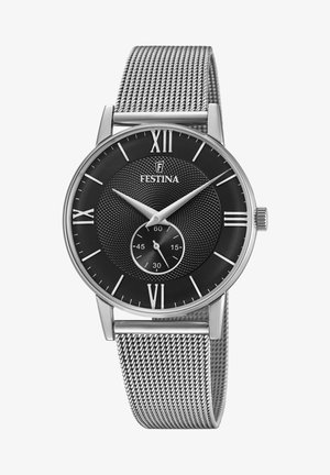 Reloj con correa de malla plateada y esfera negra texturizada, con marcadores en números romanos y un pequeño subdial. Diseño elegante y moderno con un aspecto minimalista.