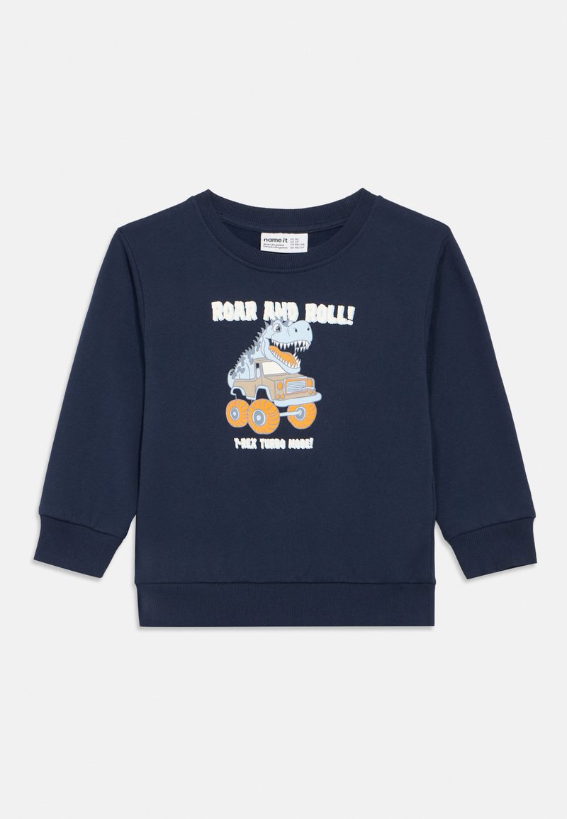 Sudadera azul marino de algodón, con un gráfico de dinosaurio y un camión con grandes ruedas. El texto dice "¡RUDA Y RUIDO! ¡HACE RUIDO TURBO!"