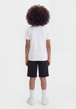 MID RELAXED LONG UNISEX - Pantaloni de trening - black