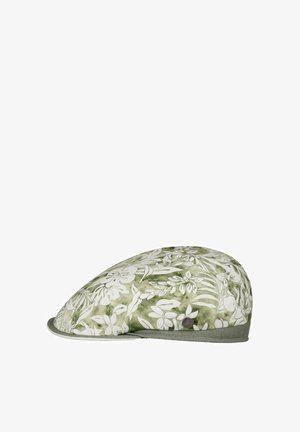 Flat cap with a green and white floral pattern, grey trim, and a small round metal brand emblem on the side.