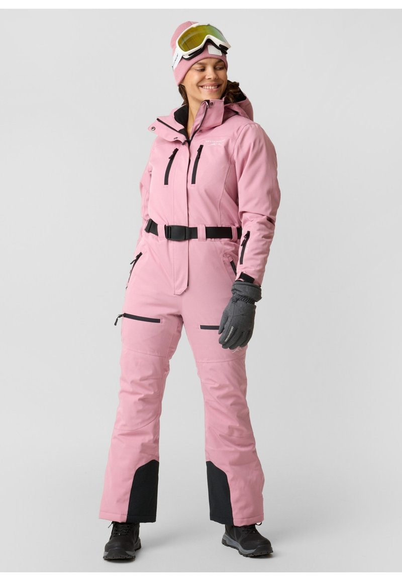 Pink one-piece ski suit with a fitted design, black accents, adjustable belt, and multiple zippered pockets. Warm gloves and ski goggles included.