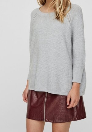 Light gray striped sweater with a wide neckline and long sleeves, paired with a burgundy faux leather zippered mini skirt.